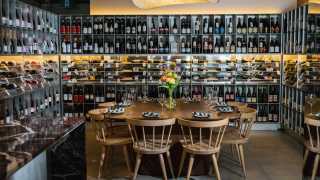 Paradise Cinema | The communal table in the wine library at Blue Door Wine Shop