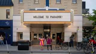 Paradise Cinema | Two drag artists pose outside of Paradise Theatre on Bloor Street