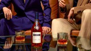 Martell Cordon Bleu cognac on a table with two glasses