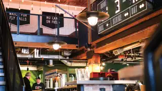 Toronto bottle shops and alcohol stores | The scoreboard and seating inside Left Field Brewery, Liberty Village, Toronto