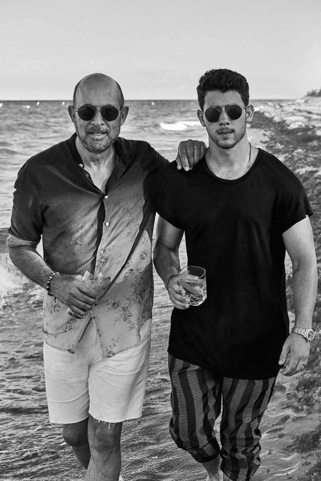 John Varvatos and Nick Jonas sipping Villa One Tequila on a beach