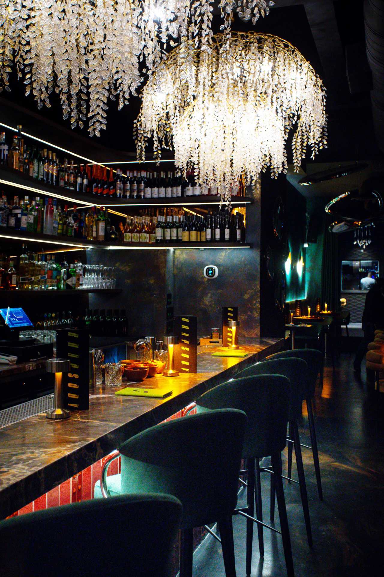 Best new restaurants in Toronto | Chandeliers above the bar at Rhapsody
