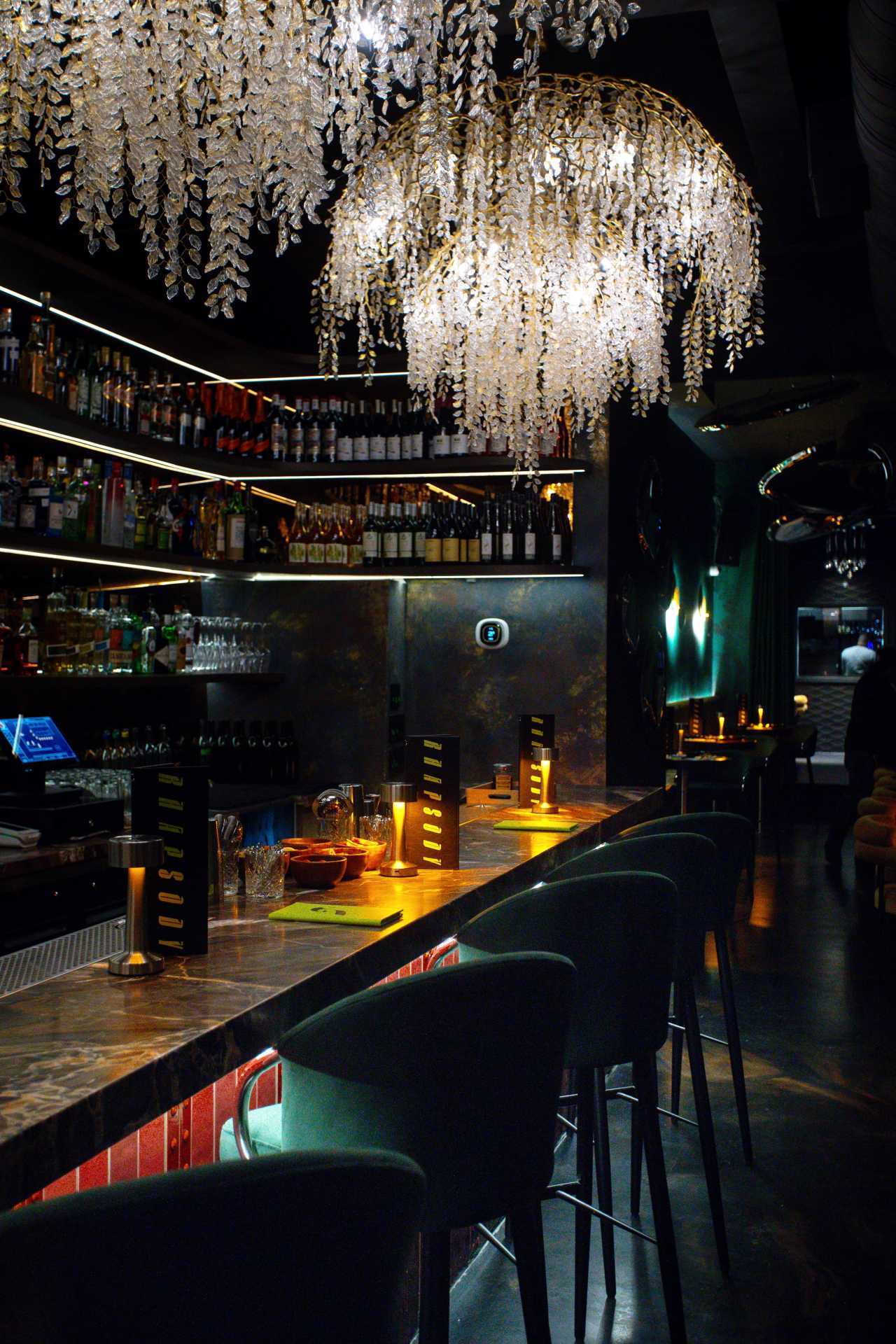 Romantic restaurants in Toronto | Chandeliers above the bar at Rhapsody on Ossington in Toronto