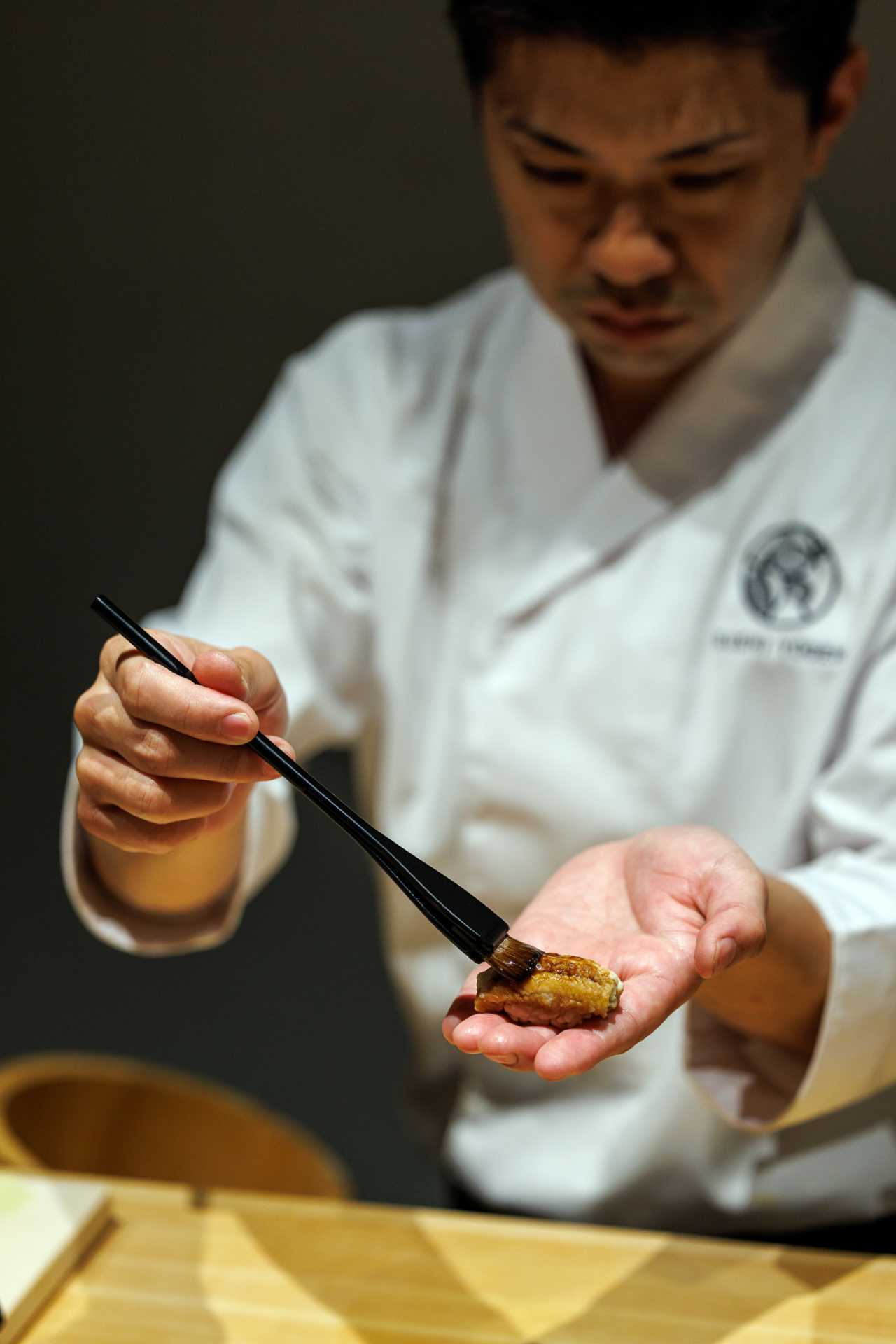 Sushi Yugen omakase in Toronto | Head chef Kyohei Igarashi prepares a piece of nigiri