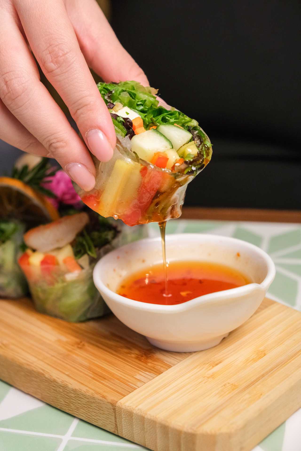 Markham restaurants | Thai fresh rolls being dipped in sauce at Chiang Rai