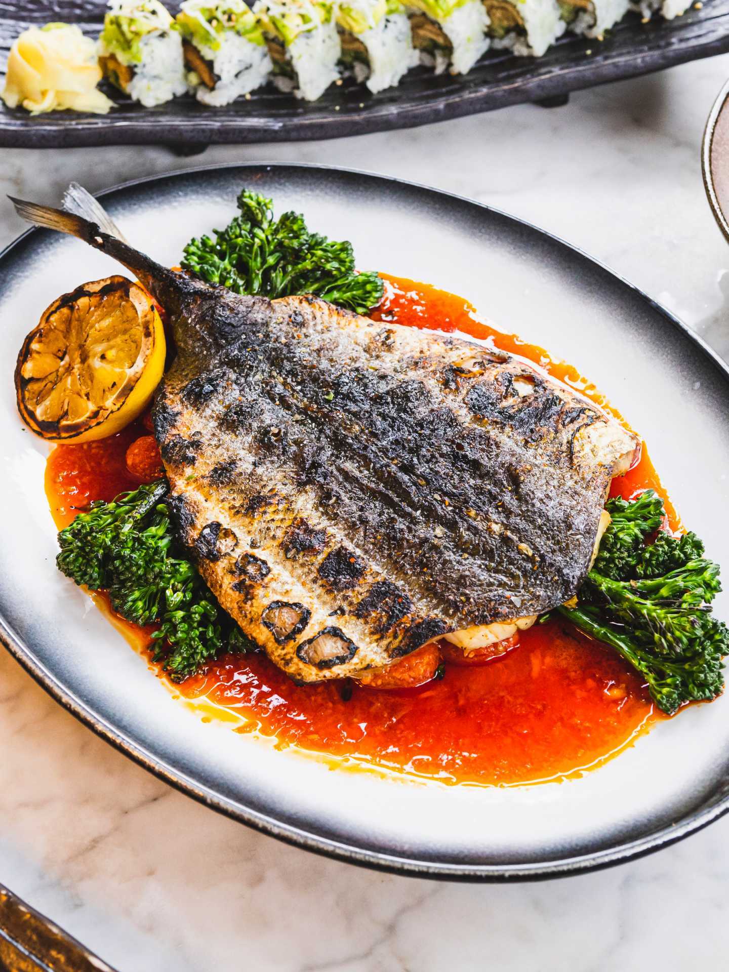Best patios in Toronto | A whole fish dish on the patio at Kasa Moto