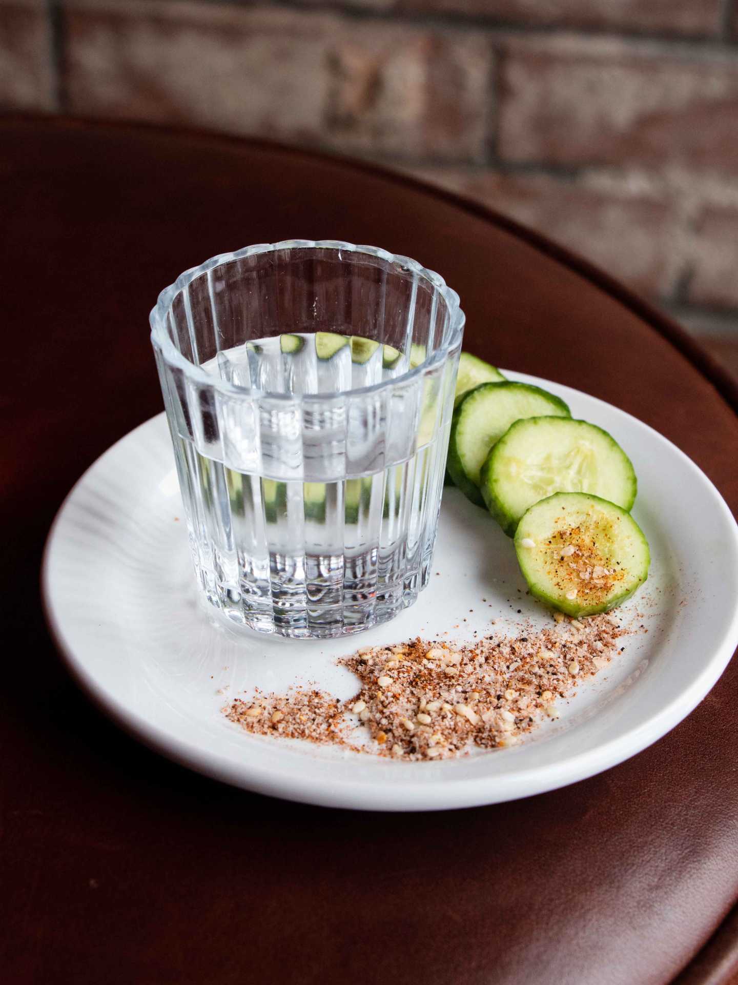 Tequila and mezcal | A glass of mezcal with cucumbers and rimming salt