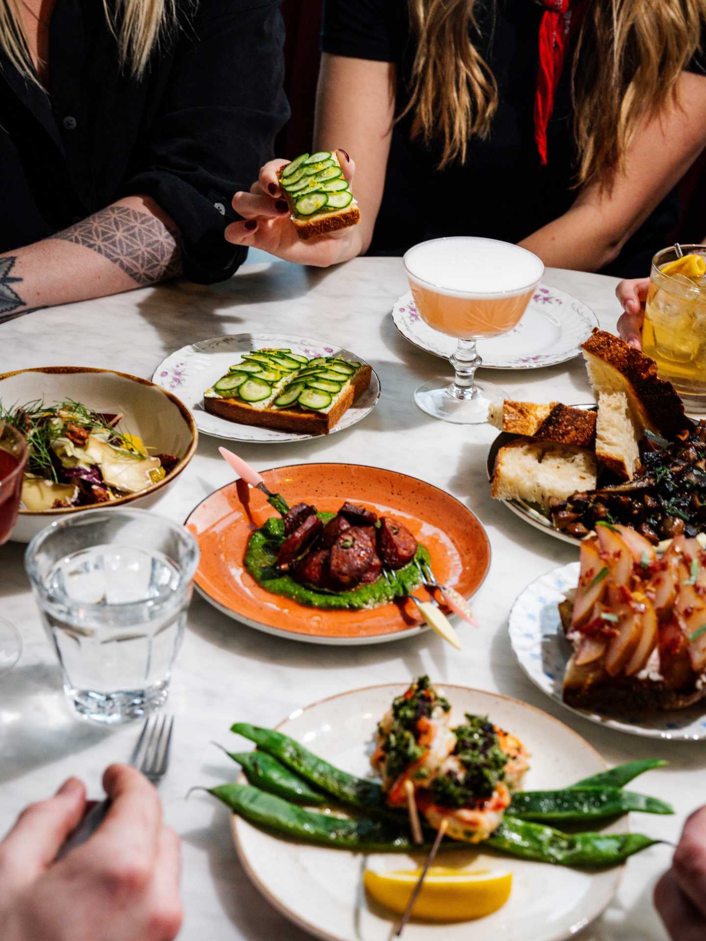 Best new restaurants Toronto | Assorted small plates of meals at Lisbon Hotel