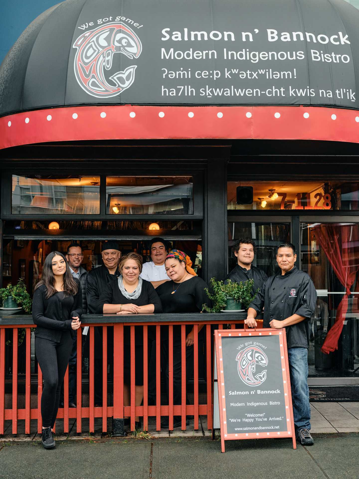 Indigenous food experiences in Canada | Owner Inez Cook and the team standing outside Salmon 'n' Bannock in Vancouver