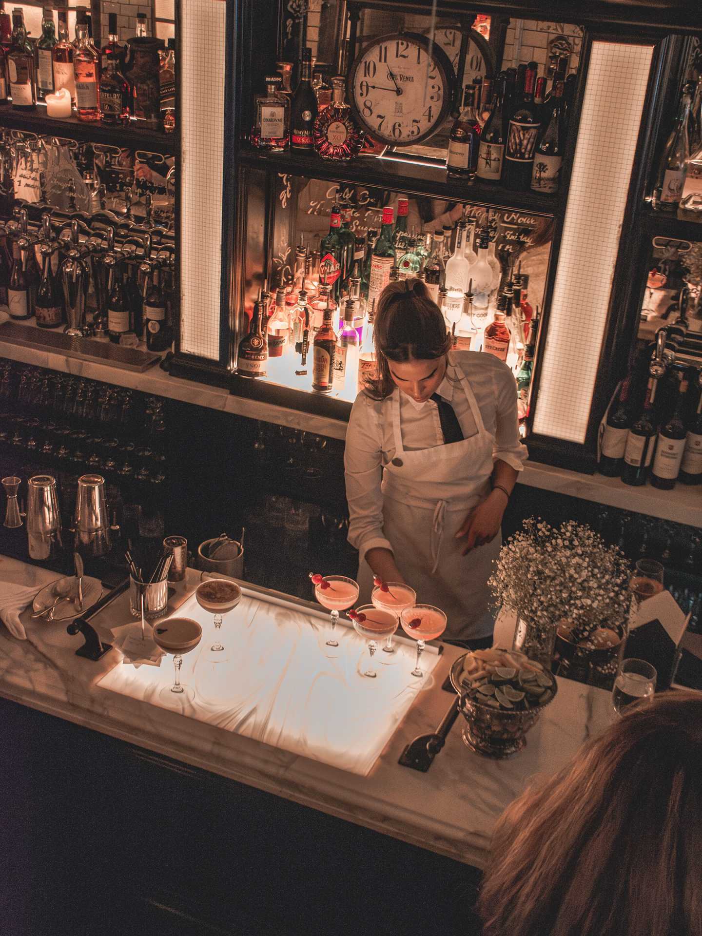 Best new Toronto restaurants | A bartender preparing drinks at Cafe Renee