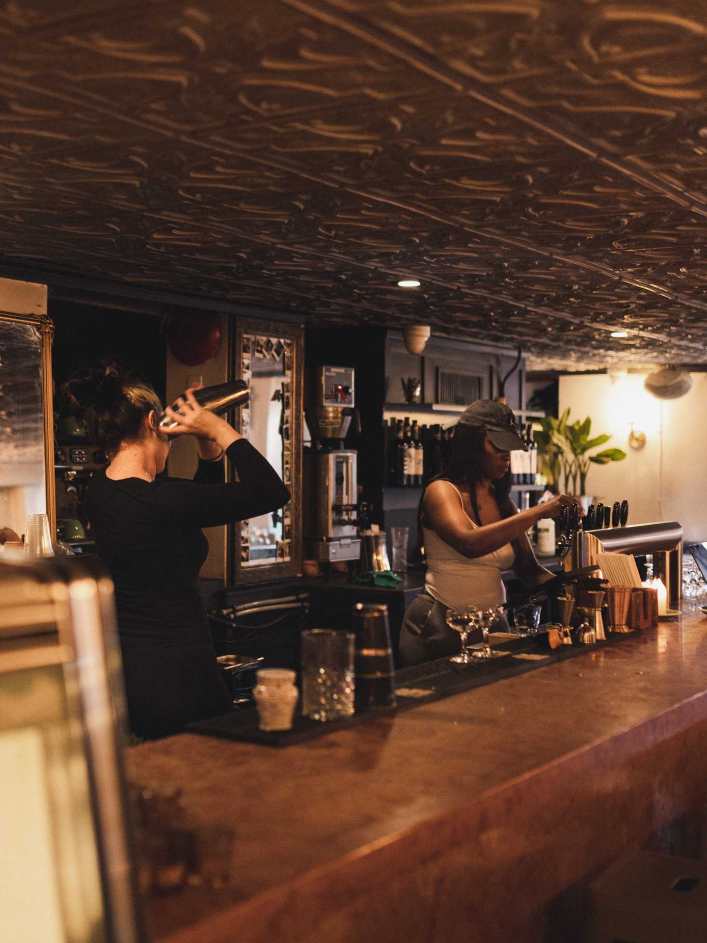 The best cafes in Toronto | Bartenders preparing drinks at Piccolo Caffe E Vino