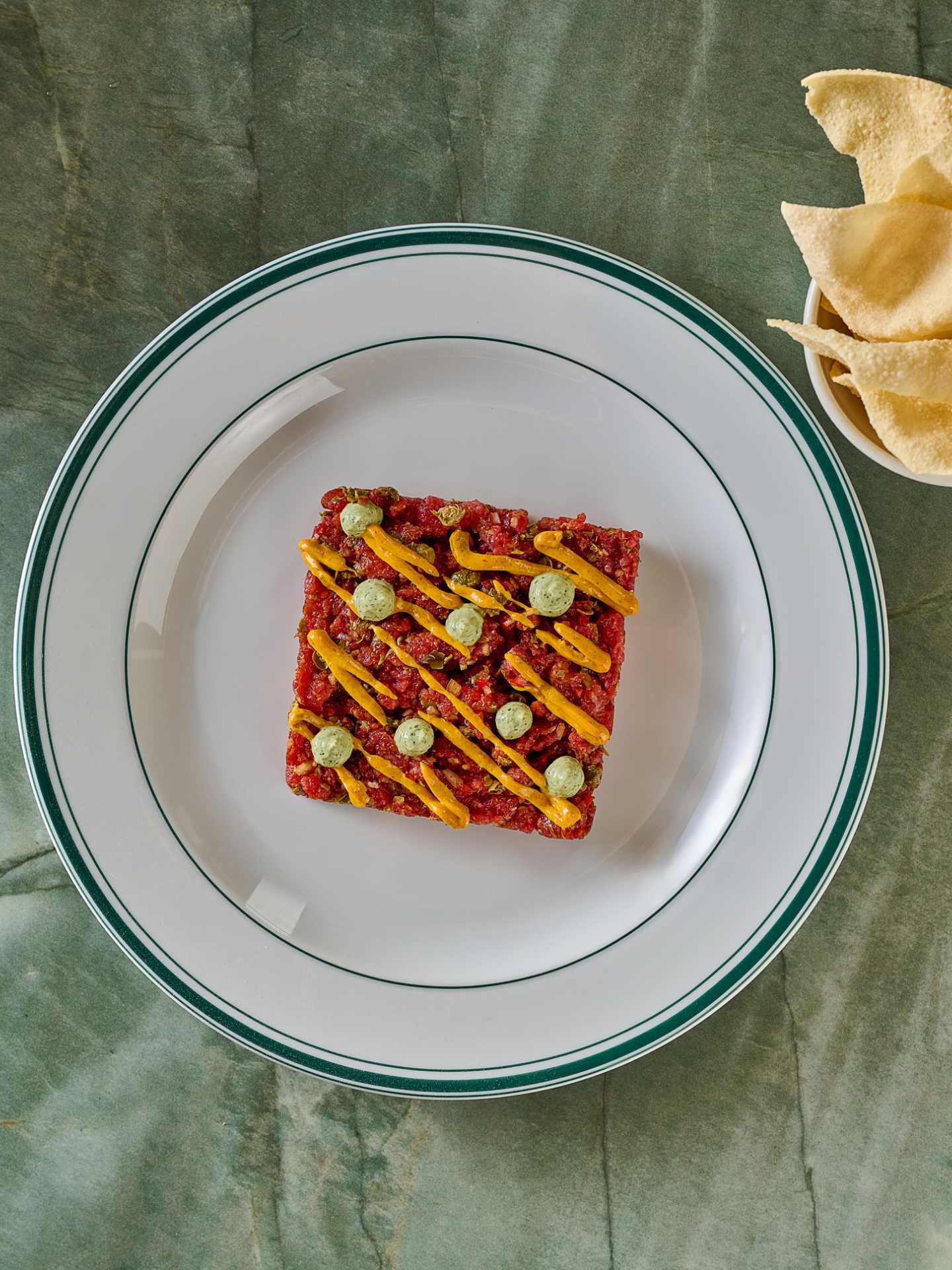 General Public | Curried lamb tartare is served with a poppadom