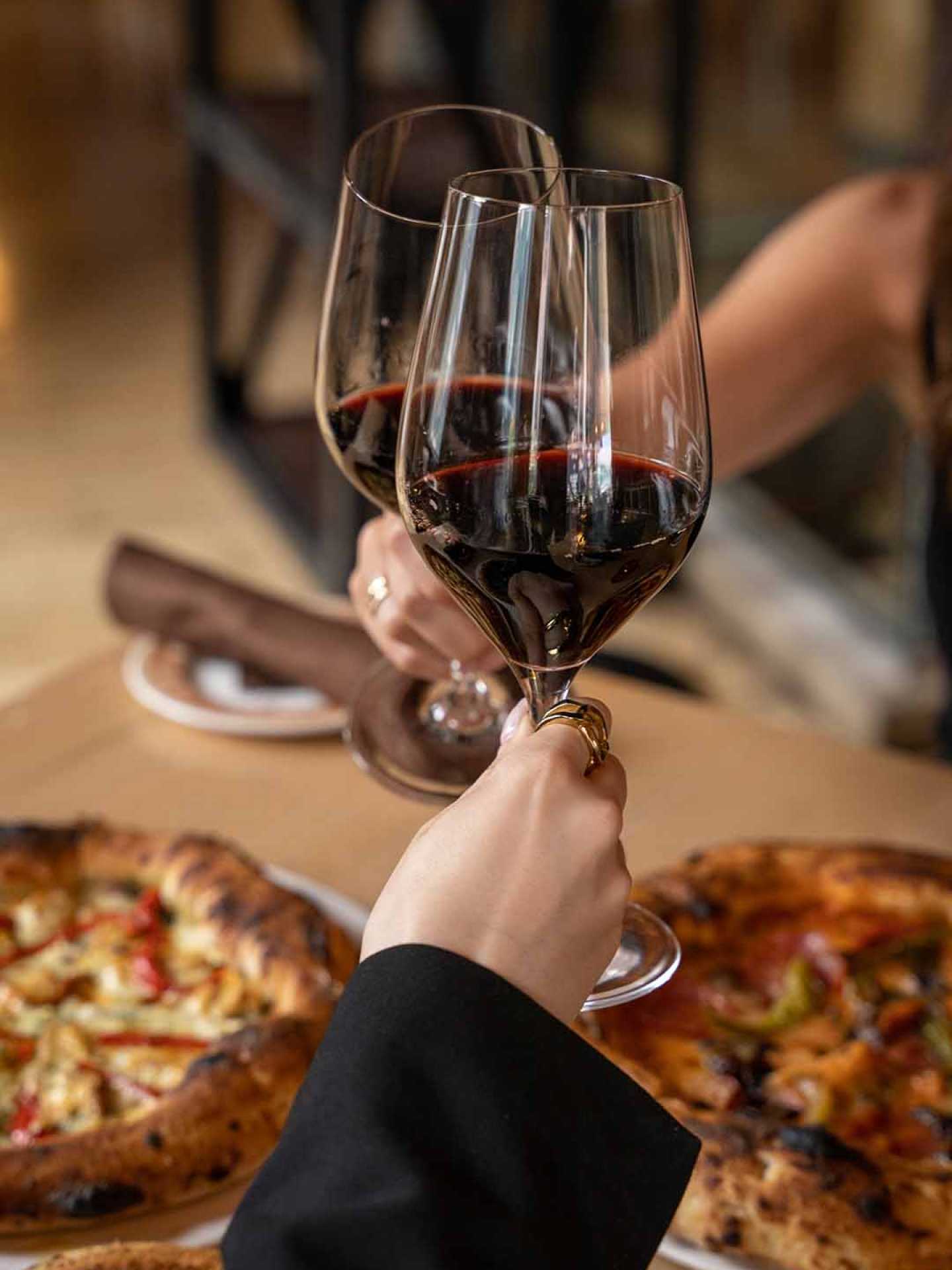 Two guests enjoying glasses of wine at Cibo Wine Bar