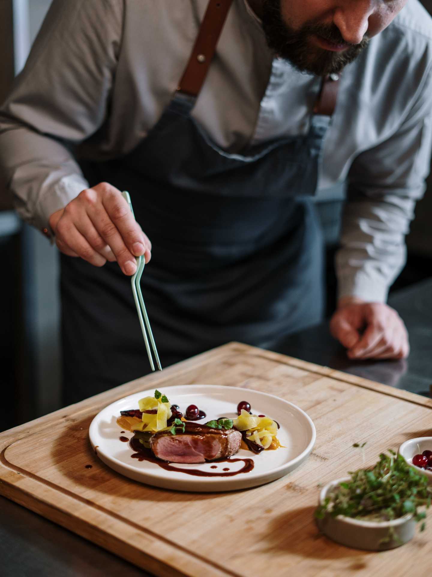 A chef preparing a plate