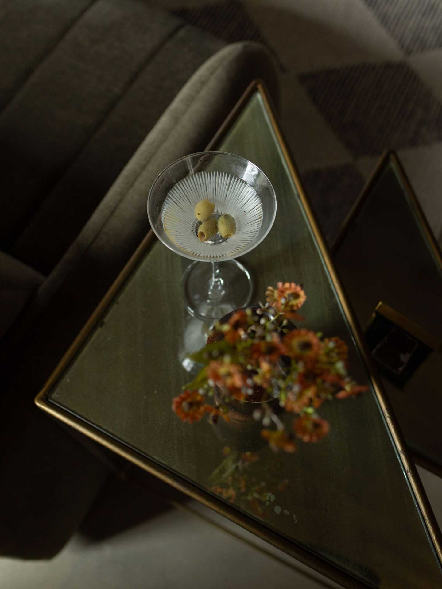 Elora Christmas Market | A side table with a martini inside Kat Florence Hotel Elora