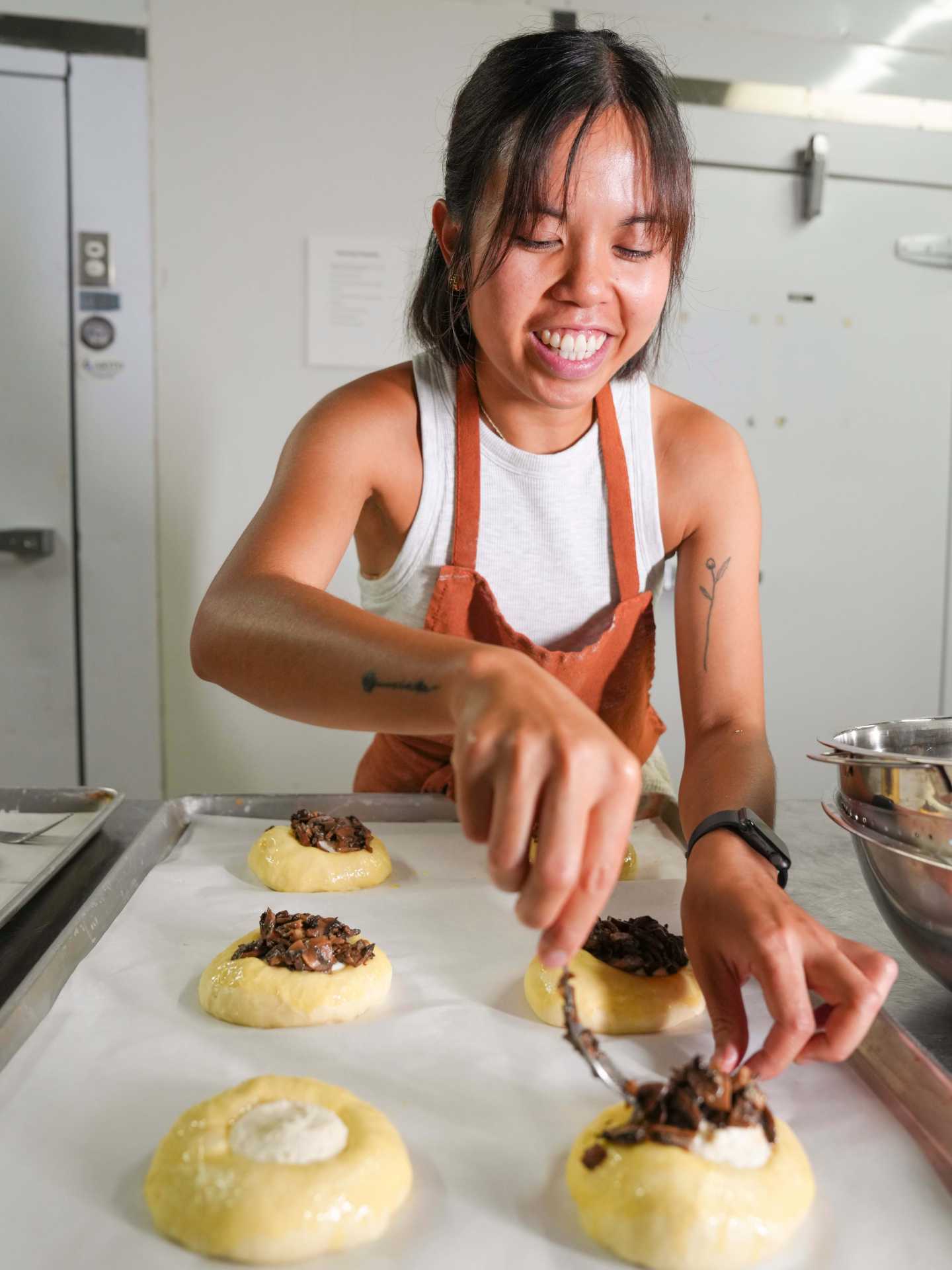 Rhea Abayan preparing pastries for Bakerrae