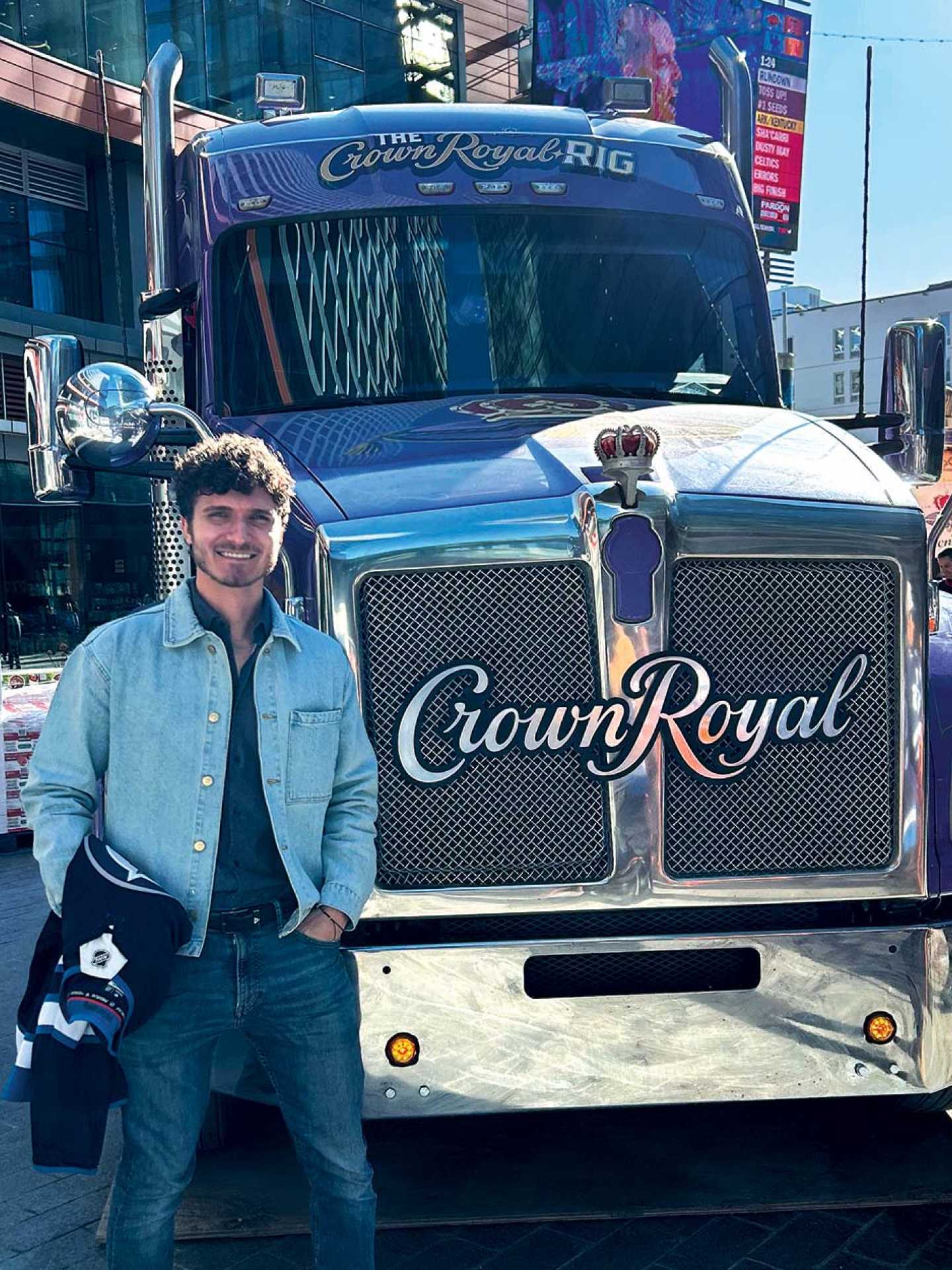 Hunter Gutman standing beside the Crown Royal Rig Hunter Gutman standing beside the Crown Royal Rig