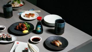 The best restaurants offering delivery and takeout in Toronto: table spread of sushi and Japanese fare at TORA