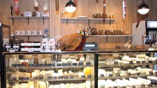 Unboxed Market, Zero waste grocery store and refillery | At the cheese counter, fill up your own container from home