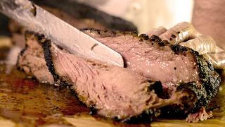 The best new restaurants in Toronto | Slicing through a slab of beef brisket Camp Smokehouse