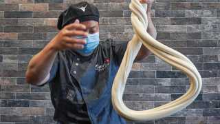 Chinese food Toronto | Omni Palace cook shaping noodles