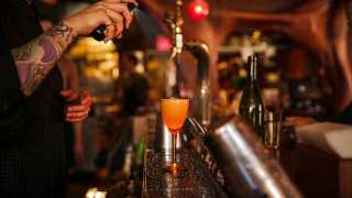 Best bars in Toronto | A bartender makes a bourbon sour at Bar Raval