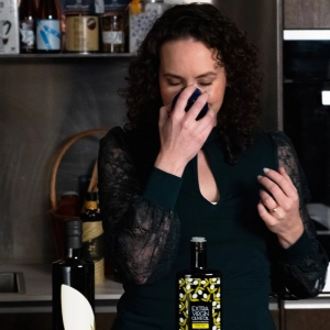 The Olive Oil critic smelling olive oil at Eataly in Toronto