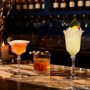 Three beautiful cocktails on the bar at Prequel and Co. Apothecary