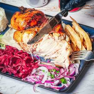 Turkish restaurants in Toronto | Cutting into a chicken at Kismet