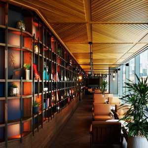 New Toronto restaurants | A long bookshelf lined seating area at TABLE Fare + Social