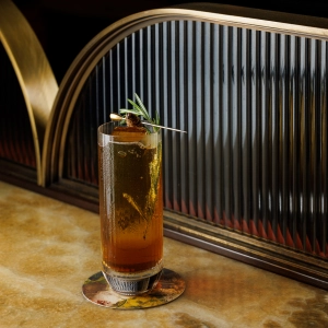 A cold cocktail sitting on a table