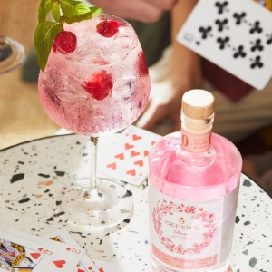 A pink glass of Ceder's Non-alcoholic spirit with a mocktail