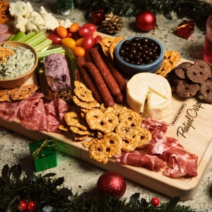 A seven-foot charcuterie board filled with pretzel crisps