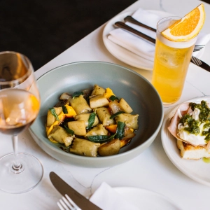 A spread of dishes and drinks at Contrada