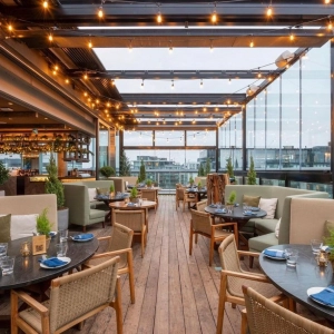 Harriets rooftop with tables and string lights