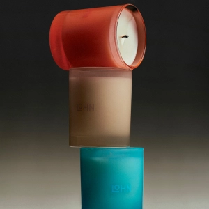 Three LOHN Resort Collection candles stacked on top of each other