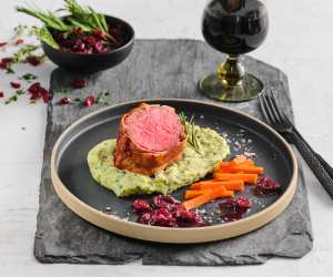 Pancetta Wrapped Veal Tenderloin accompanied by Herb Holiday Mash, Maple Carrots and Cranberry Cabernet Demi recipe