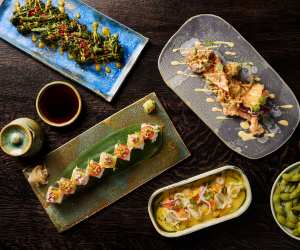Chotto Matte | Beautiful vegan sushi, ceviche and broccolini on plates and a dining table