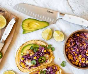 Kilne Ultimate Knife Set review | Santoku knife and paring knife on counter with bright tacos