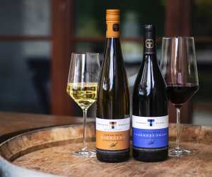 Best wineries in Beamsville | Two bottles of wine on a barrel at Tawse Winery