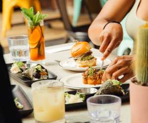 Someone cuts into steak tartare at the Drake Cafe