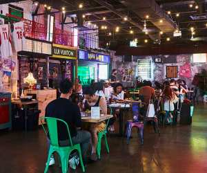 Late night food in Toronto | Guests sitting and eating at the table at Superfresh