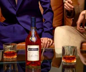 Martell Cordon Bleu cognac on a table with two glasses