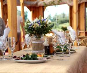 A decorated table with plates and flowers