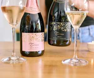 Two glasses and two bottles of sparkling wine from Trius Winery & Restaurant in Niagara