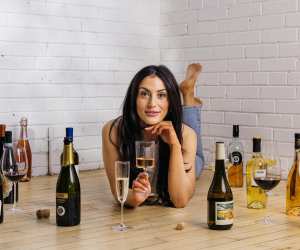 Canadian wine | Wine expert Lauren Power surrounded by wine bottles